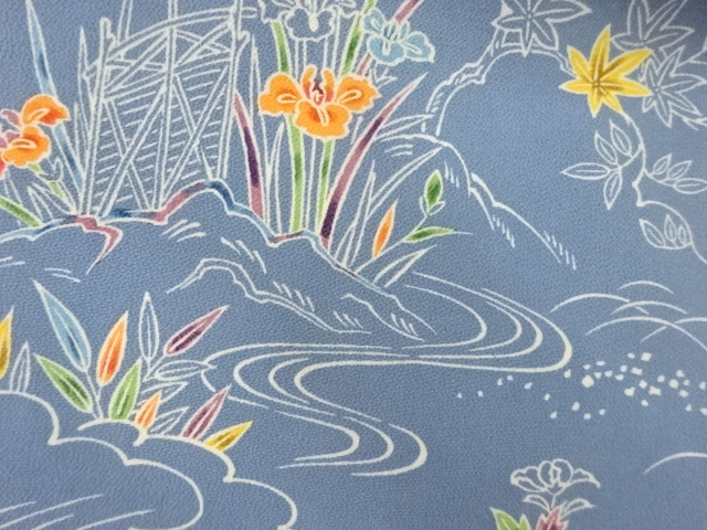  縮緬地柴垣に流水・草花模様名古屋帯